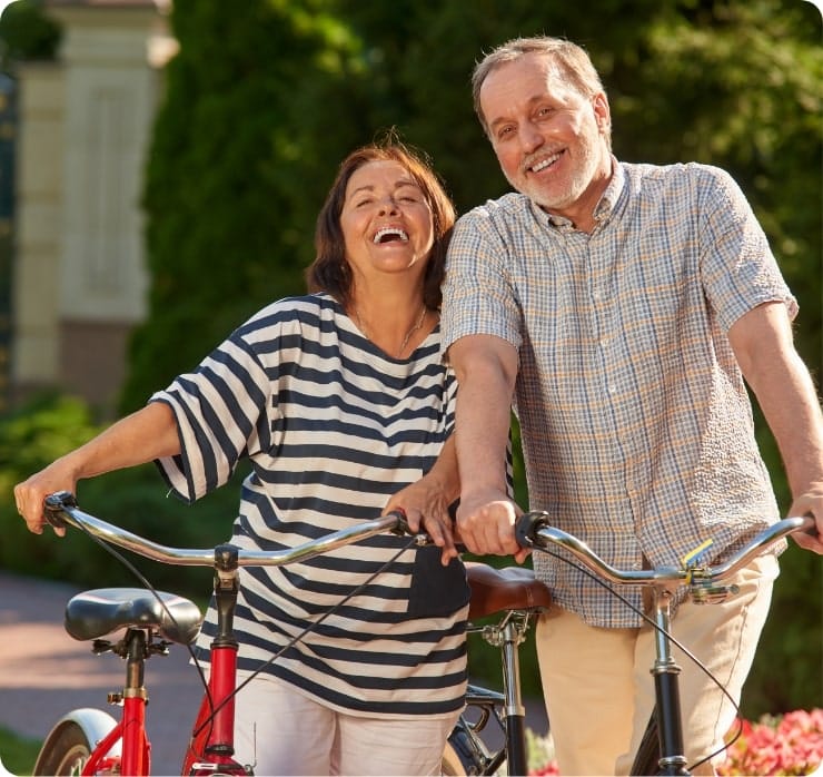 Middle aged couple with bikes ready to visit a Lynn Clinical Study program